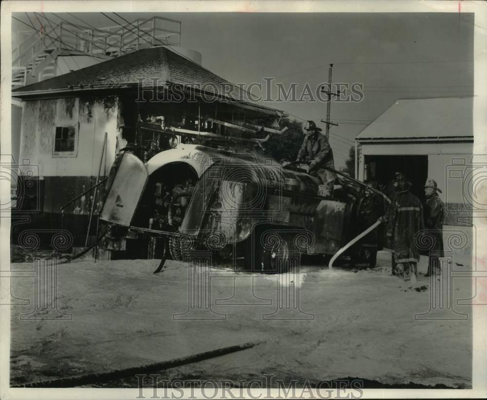 1959 Press Photo Firefighters use foam on fire at Midland Cooperative plant- Historic Images