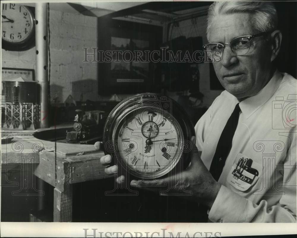 1966 Press Photo Railroad Collector Wesley Foshay with clock in Wisconsin
