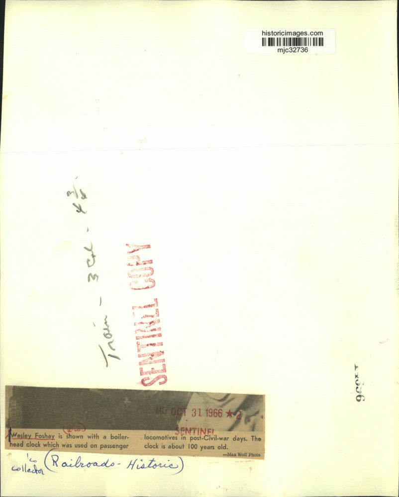 1966 Press Photo Railroad Collector Wesley Foshay with clock in Wisconsin