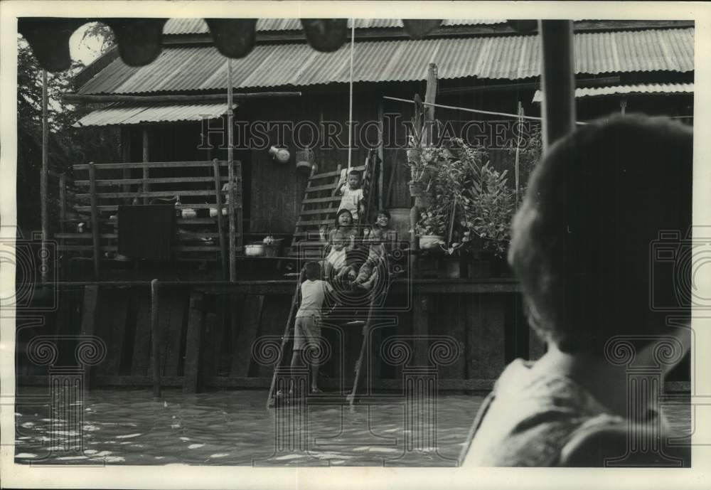 1967 Press Photo Children play on the front porch of their home in Bangkok.- Historic Images