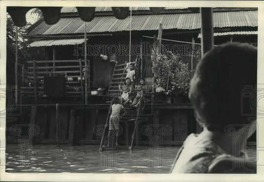 1967 Press Photo Children play on the front porch of their home in Bangkok.- Historic Images