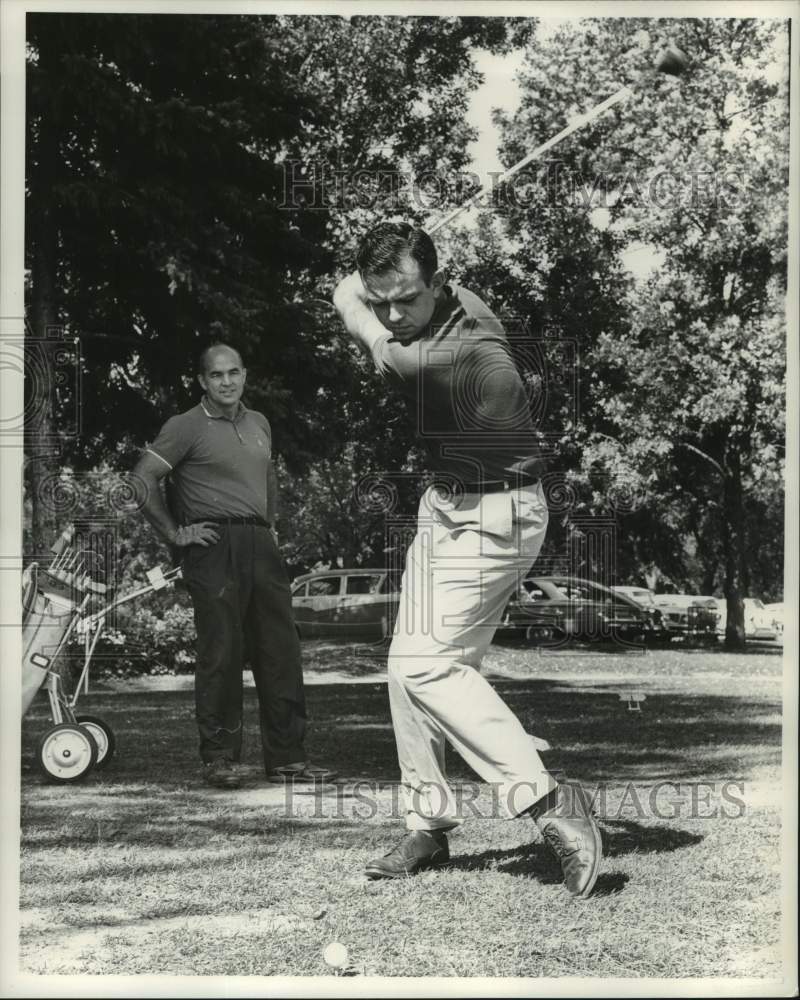 Load image into Gallery viewer, 1961 Press Photo Golfer Prepares to Tee Off on Ball - mjc36077

