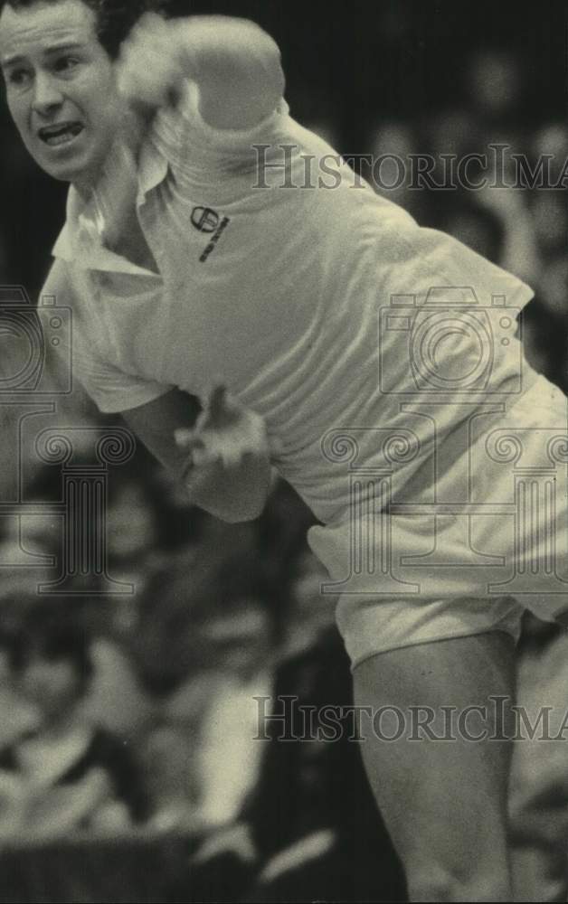 1983 Press Photo John McEnroe flipped a serve during a tennis match at the Arena- Historic Images