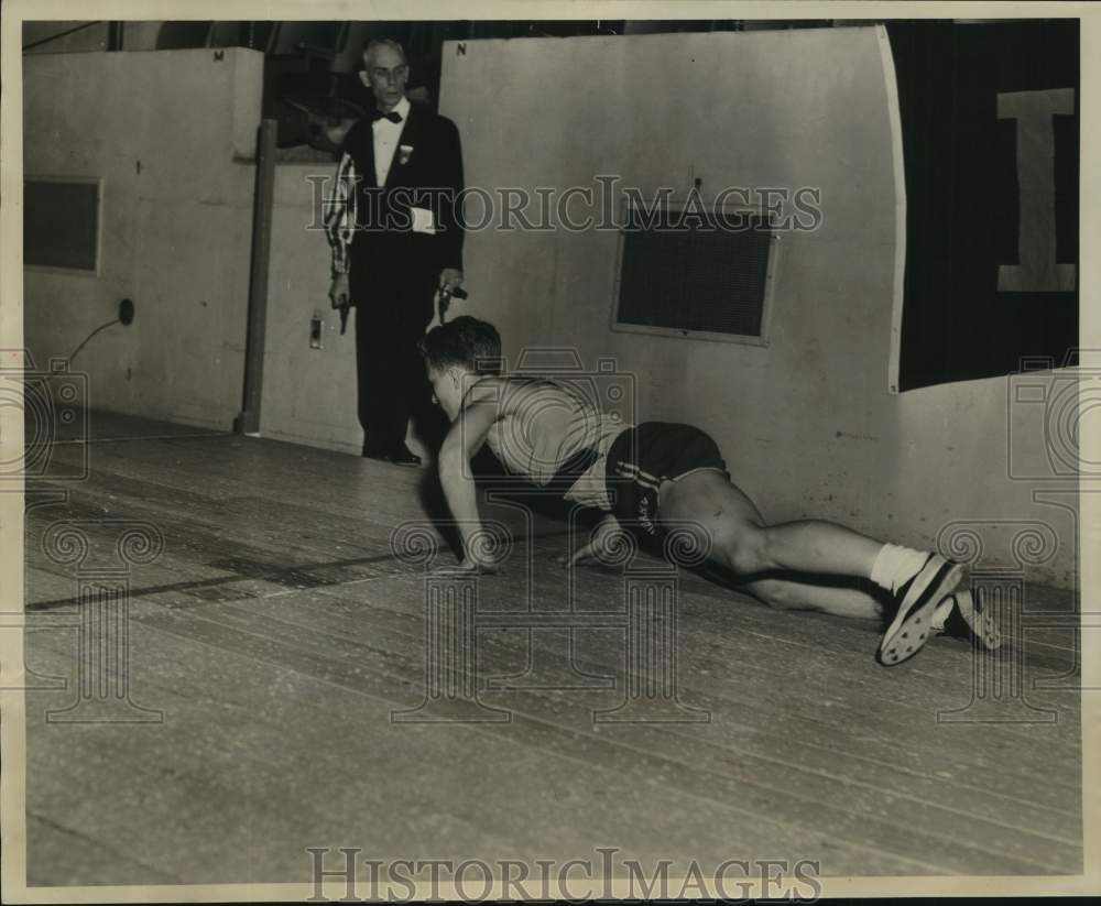 1956 Press Photo Cudahy Runner Edwin Wicklander Falls After Handing Off Baton