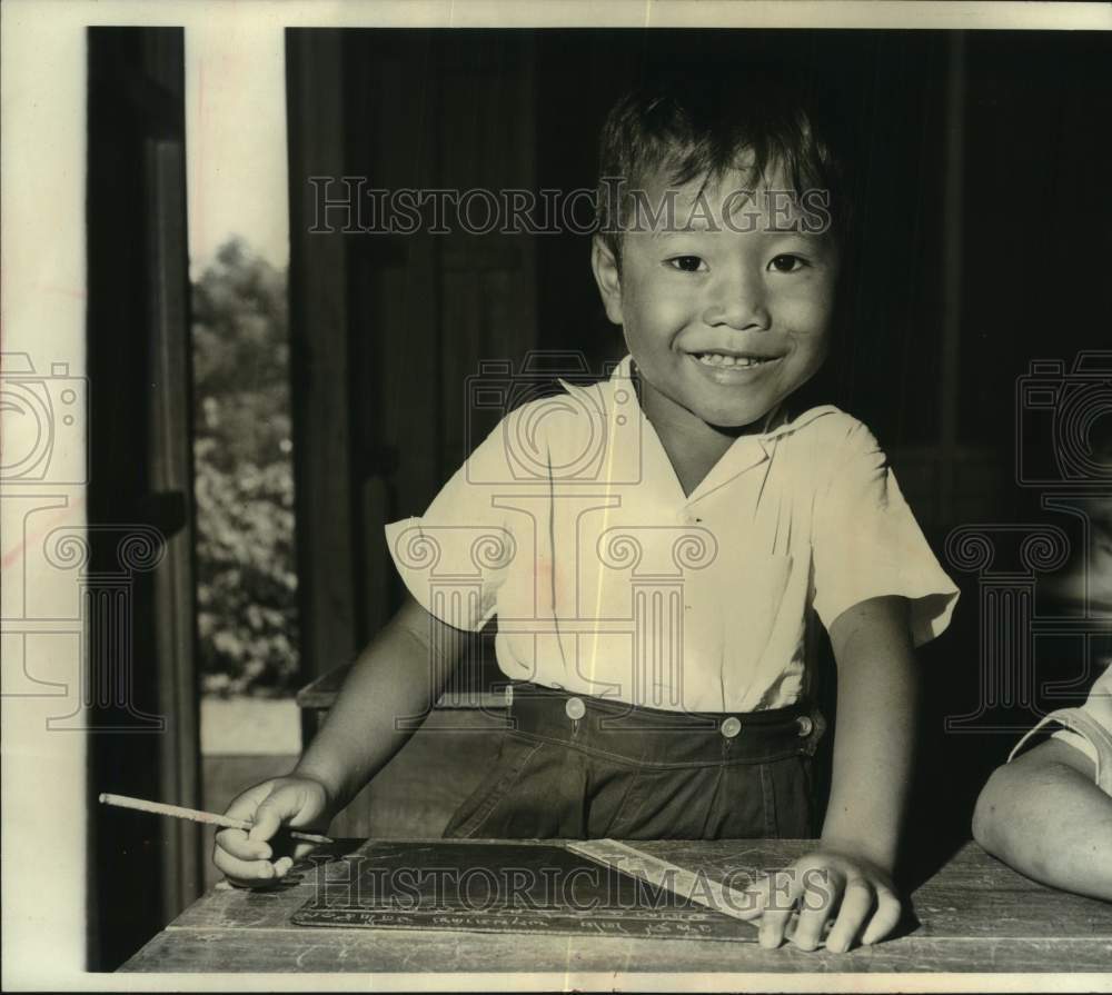 1964 Press Photo A young boy in primary class in Bangkok, Thailand - mjc36756- Historic Images