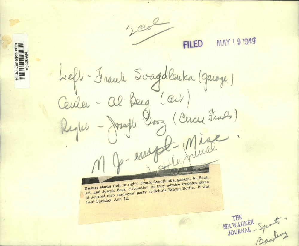 1949 Press Photo Men's bowling team members admire trophies at Journal party