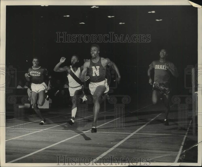 Load image into Gallery viewer, 1953 Press Photo Sprinters race for the finish line, at college Men's Track meet
