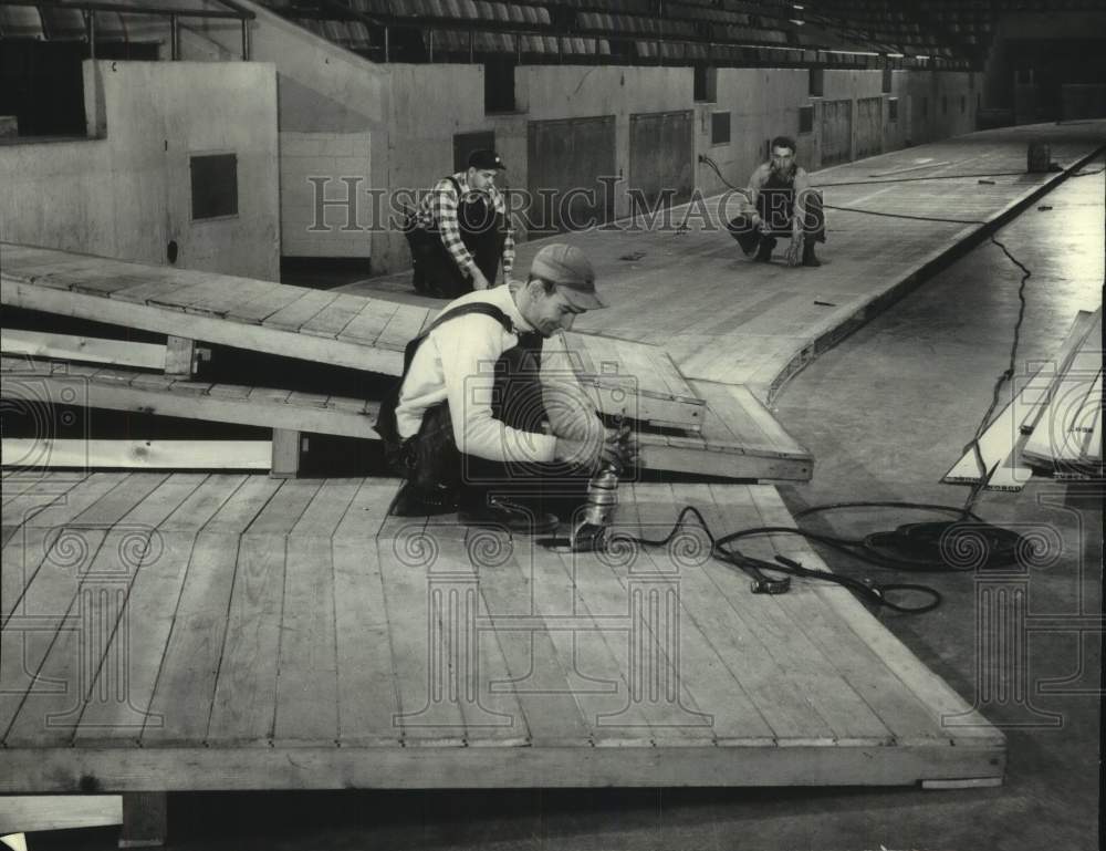 1952 Press Photo Crewmen work on board track for Milwaukee Journal track meet- Historic Images