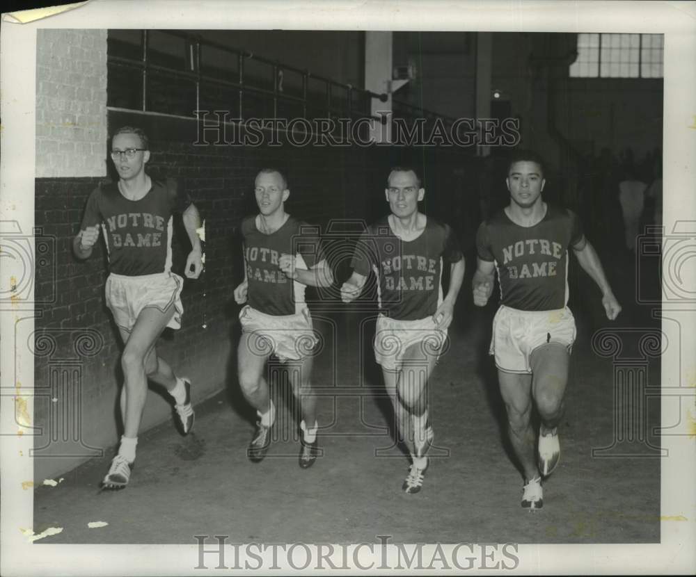 1957 Press Photo Notre Dame mile relay team runs at Milwaukee Journal track meet- Historic Images