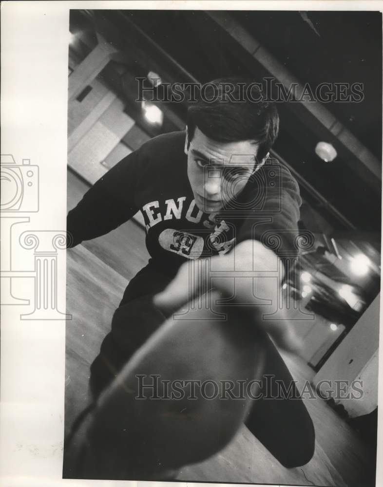 1963 Press Photo Ron Taffora of Kenosha high school stretched at Milwaukee Arena- Historic Images