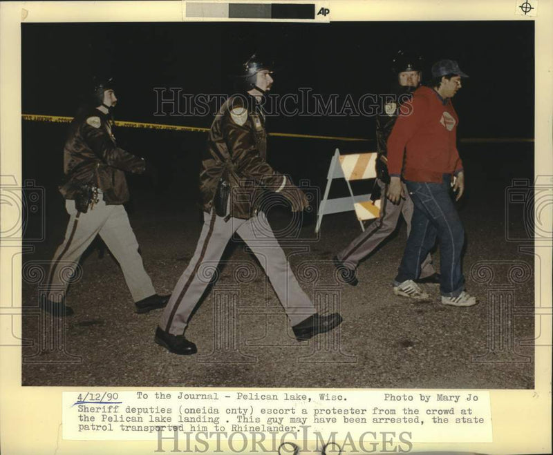 Load image into Gallery viewer, 1990 Press Photo Man arrested at Pelican Lake protest in Wisconsin. - mjc38216
