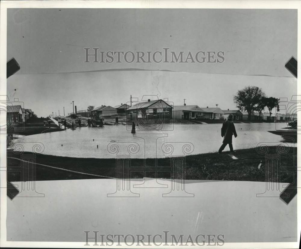 1957 Press Photo Milwaukee firemen pumping water out of flooded streets, WI