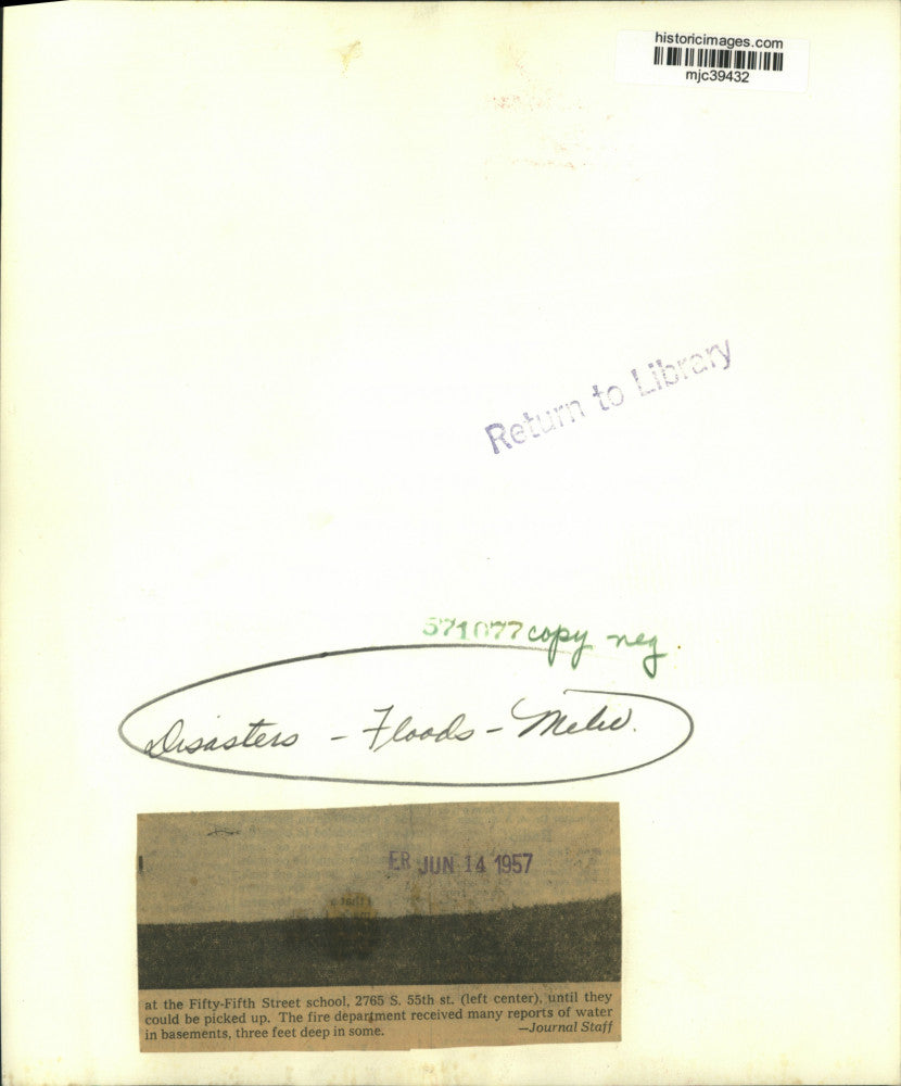 1957 Press Photo Milwaukee firemen pumping water out of flooded streets, WI