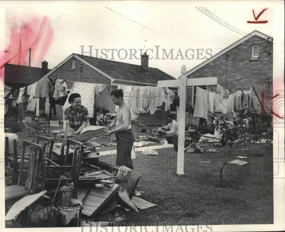 1952 Press Photo Roy V. Johnson Works to Clean Up Home After Flood in Milwaukee