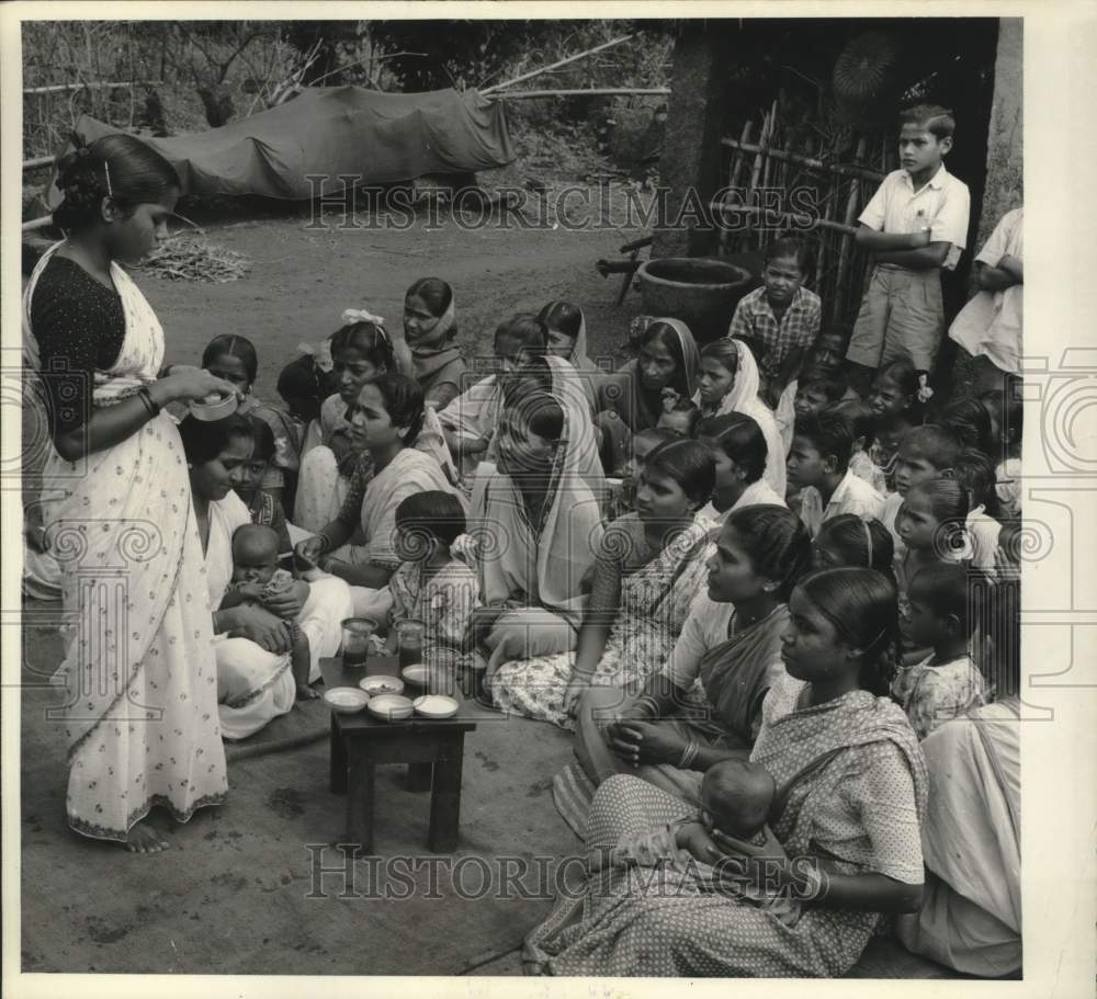 1963 Press Photo Woman with an audience at Home Economics Training Center, India