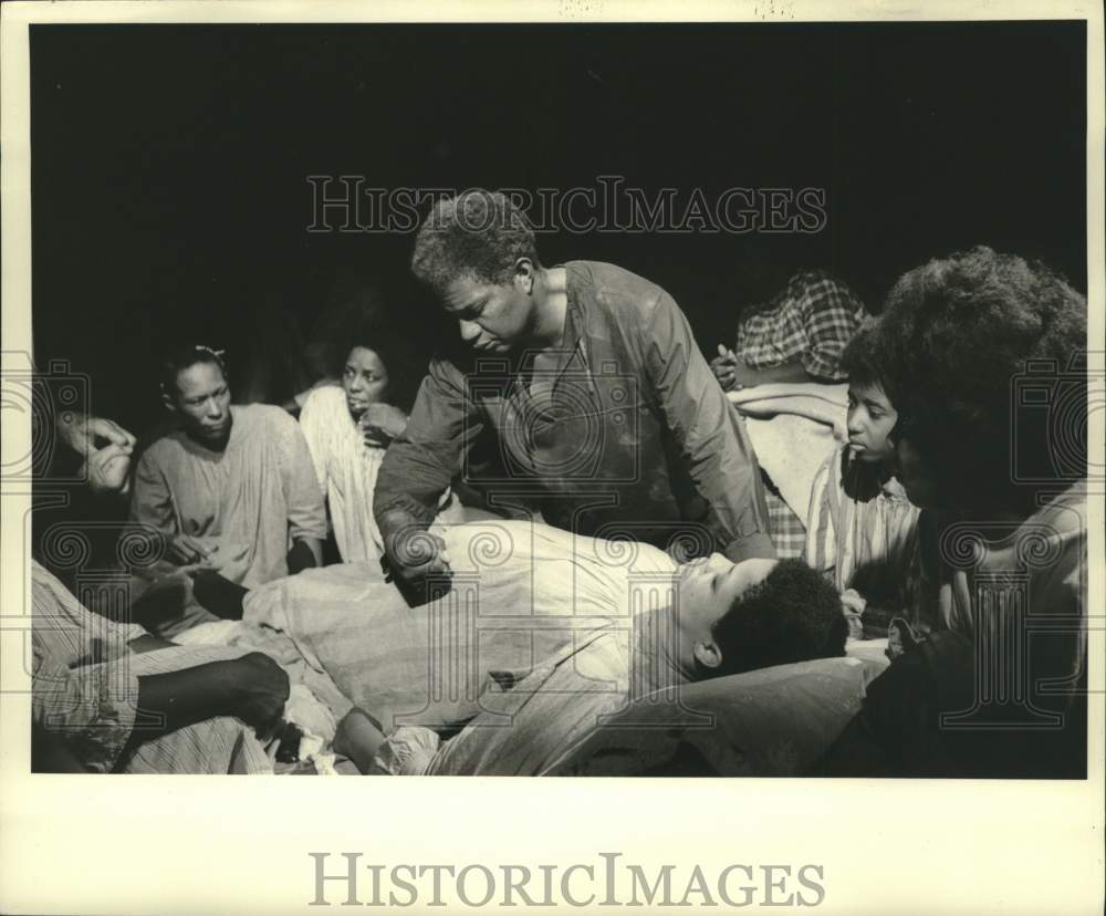 1968 Press Photo Actor Ossie Davis in movie scene assisting in childbirth.- Historic Images