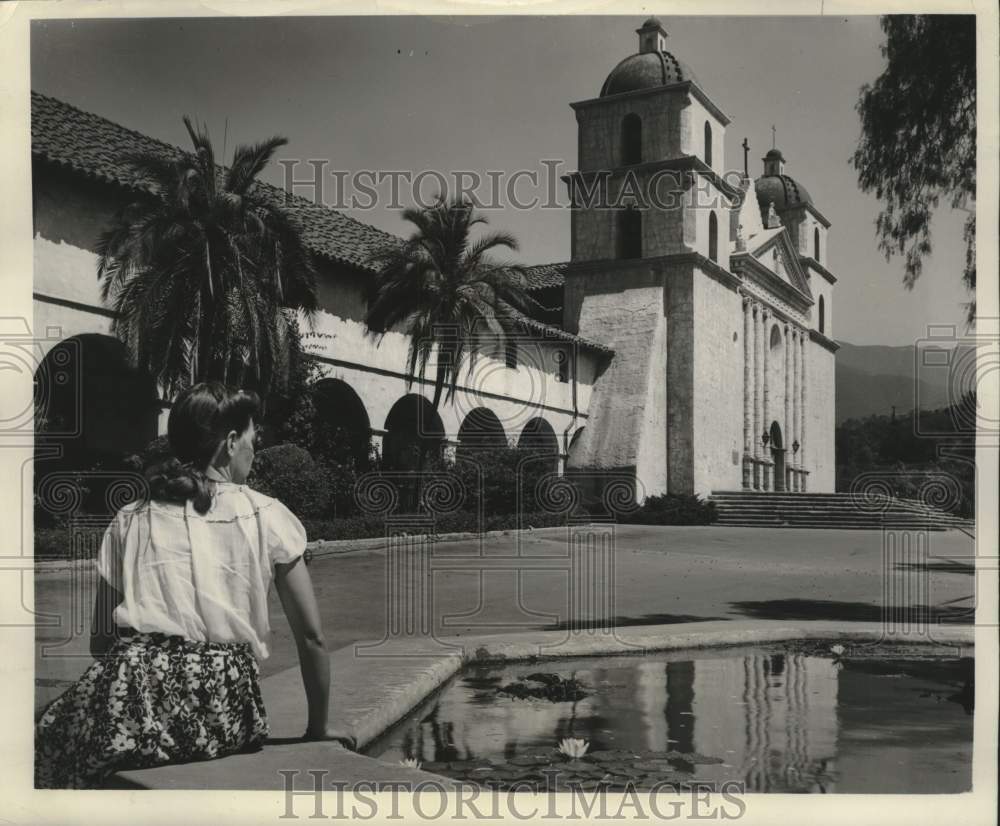 1948 Press Woman sits by pool of California mission - mjc41480- Historic Images