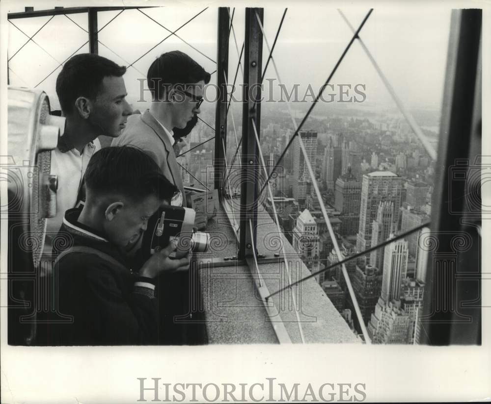 1961 Press Photo Milwaukee Journal Newsboys peer out at a city of skyscrapers