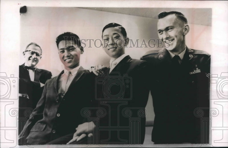 Load image into Gallery viewer, 1962 Press Photo New Berlin airman, with his adopted Korean boys, Wisconsin
