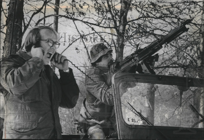 Load image into Gallery viewer, 1970 Press Photo Gary Whitney holds ears as Jerry Smith fires gun, Wisconsin
