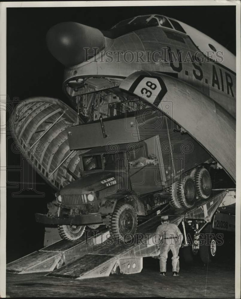Load image into Gallery viewer, 1960 Press Photo USAF Crew Load Water Purification Truck Aboard Transport Plane
