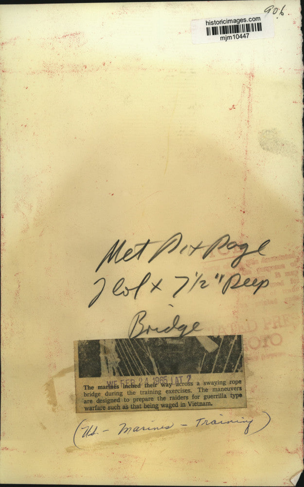 1965 Press Photo US Marines walk across rope bridge, training for Vietnam War