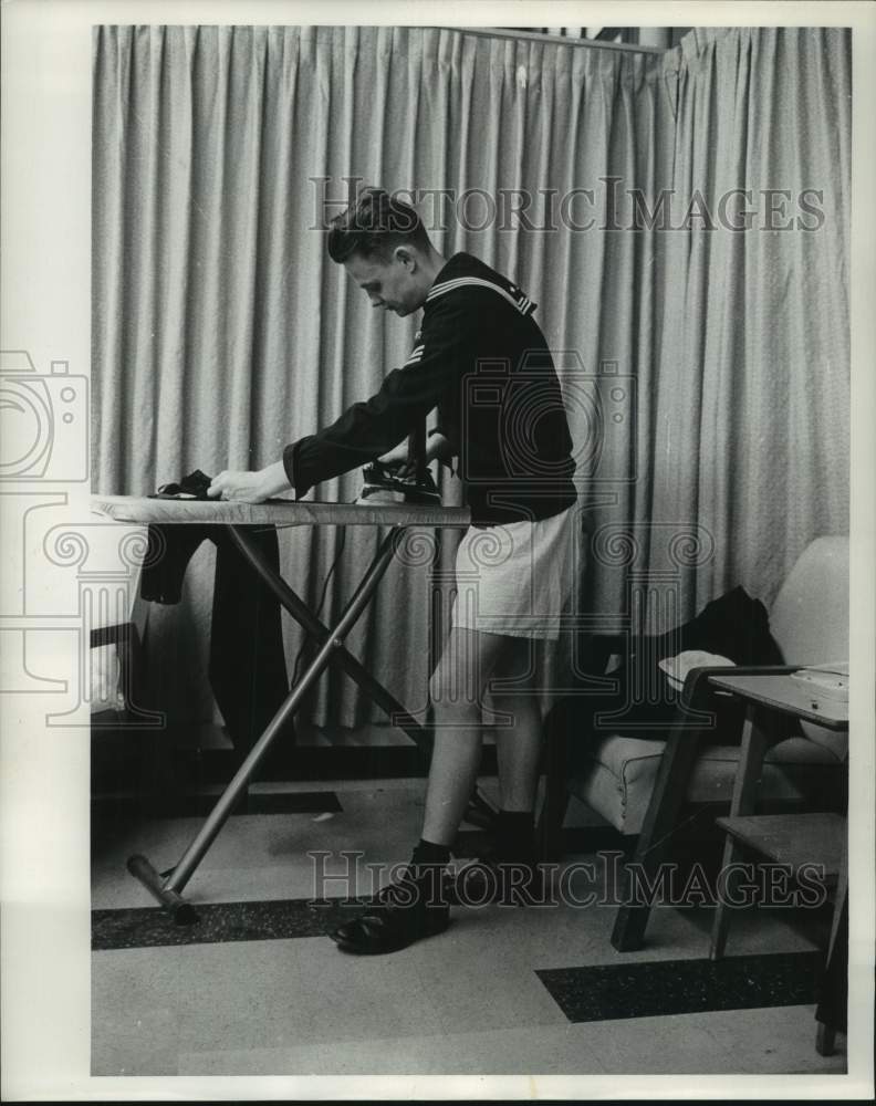 1963 Press Photo Seaman William Ortuay of New York presses pants in Milwaukee