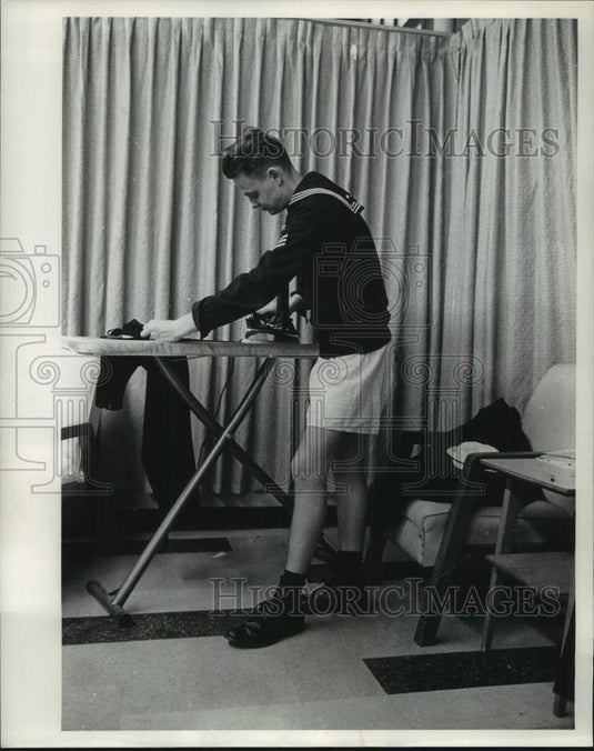 1963 Press Photo Seaman William Ortuay of New York presses pants in Milwaukee