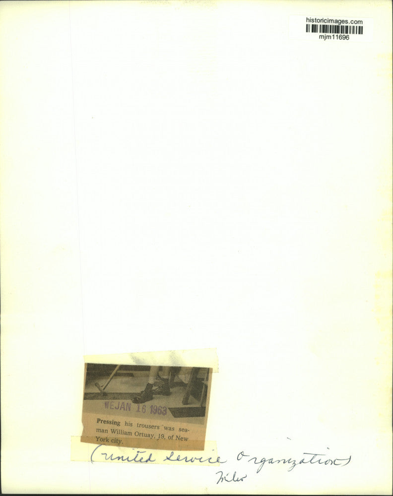 1963 Press Photo Seaman William Ortuay of New York presses pants in Milwaukee