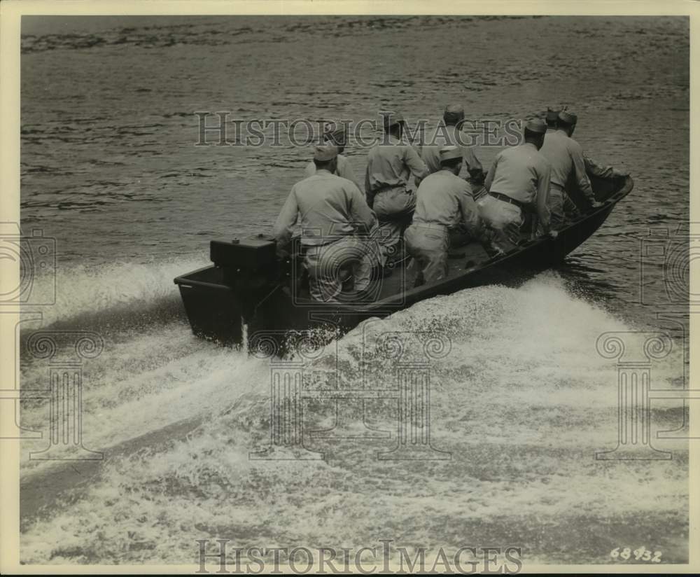 1944 Press Photo Soldiers in Evenrude Landing Boat for United States Army