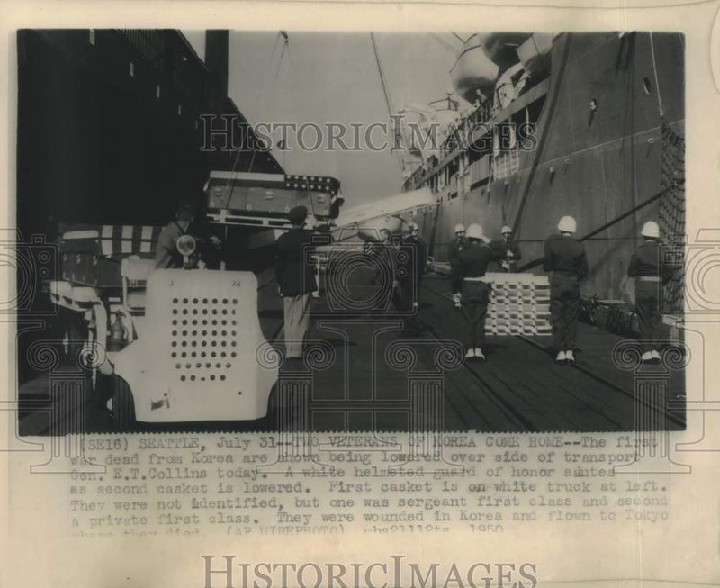 Load image into Gallery viewer, 1950 Press Photo Caskets of dead from Korean war lowered from ship in Seattle.
