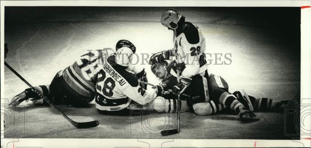 1990 Press Photo Hockey players fall down during faceoff - mjo00302- Historic Images