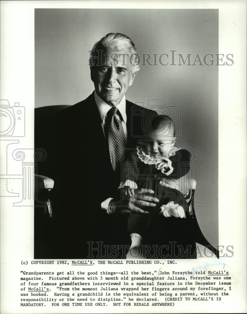 1982 Press Photo John Forsythe holds his granddaughter, Juliana - mjp15151- Historic Images