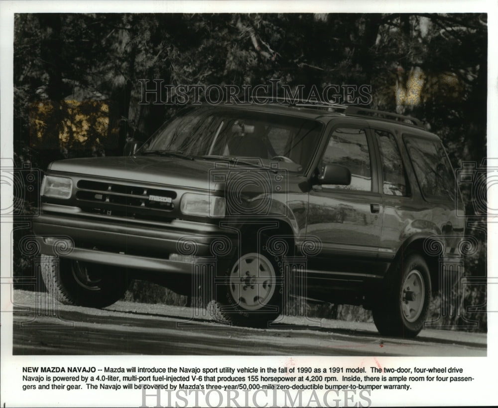 1990 Press Photo Mazda 1991 Navajo model parked in front of trees - mjp17434