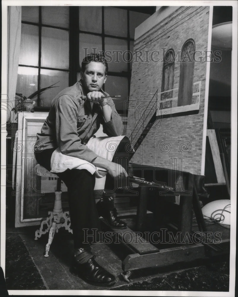 1961 Press Photo Robert Memmel, sits in studio with his painting, Milwaukee- Historic Images