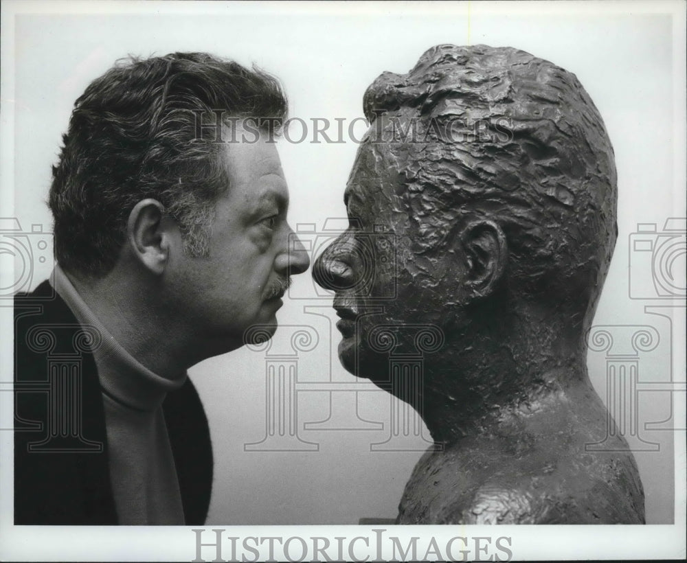 1967 Press Photo Director Hal Kanter stares at bronze bust on NBC-tv- Historic Images