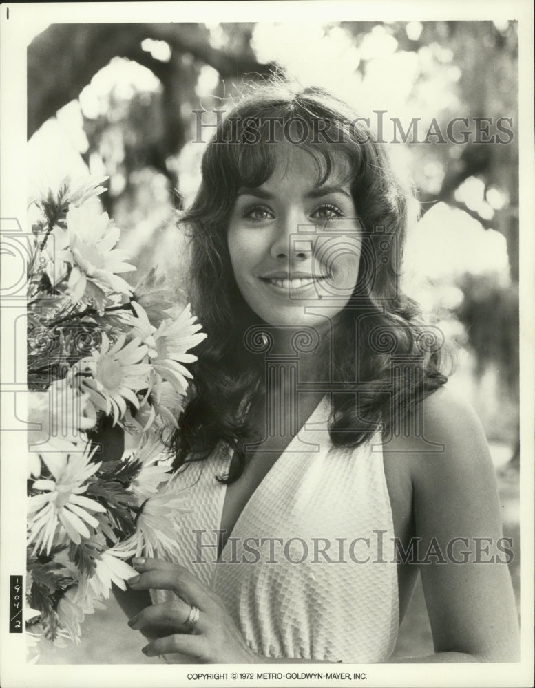 1972 Press Photo Rebecca Dianna Smith actress smiling by flowers. - mjp32368- Historic Images