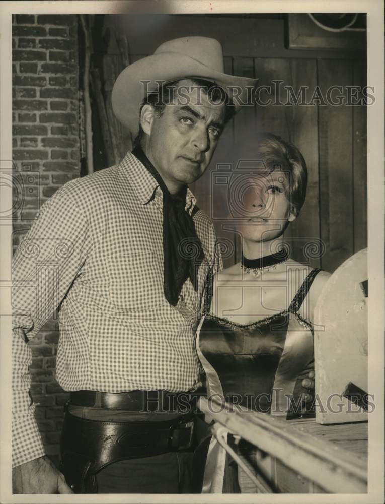 1985 Press Photo Actor Rory Calhoun on set with young lady. - mjp44084- Historic Images