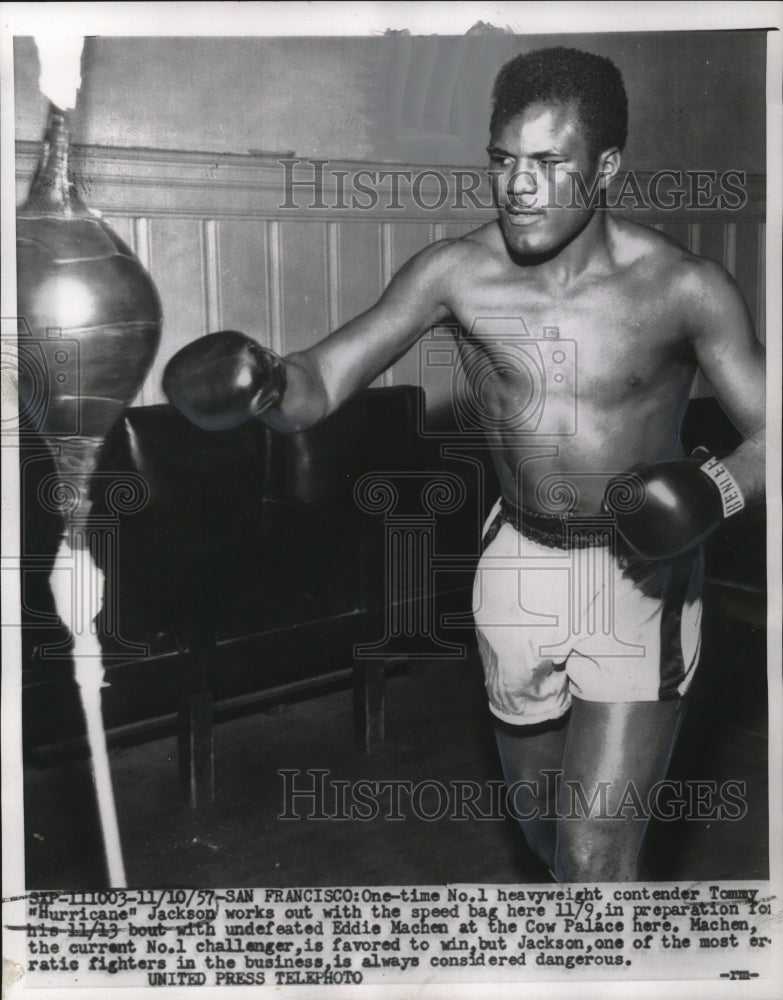 1957 Press Photo Tommy "Hurricane" Jackson works out with speed bag here 11/9.- Historic Images