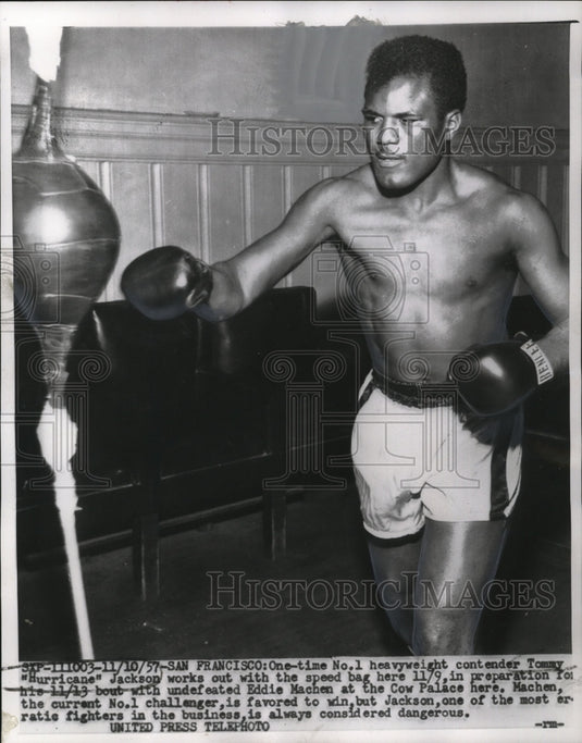 1957 Press Photo Tommy "Hurricane" Jackson works out with speed bag here 11/9.- Historic Images