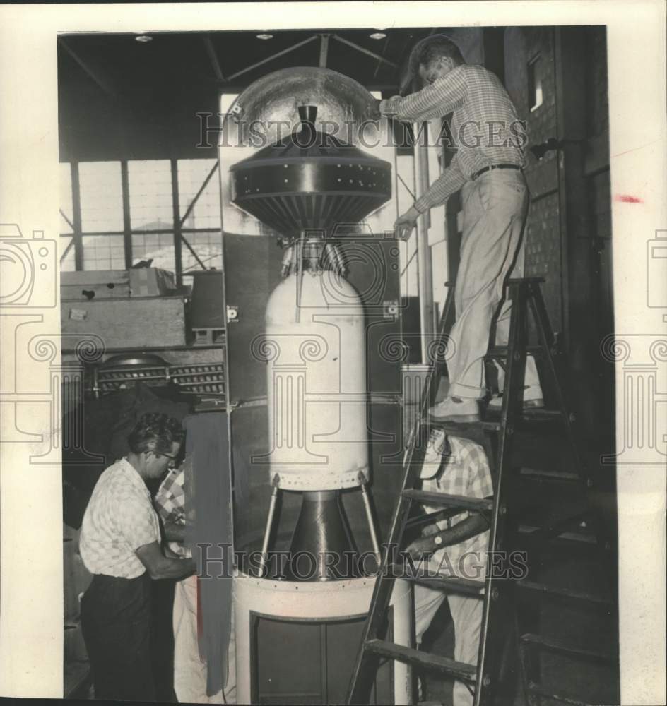 1958 Press Photo Technicians test the fitting of a Pioneer nose covering