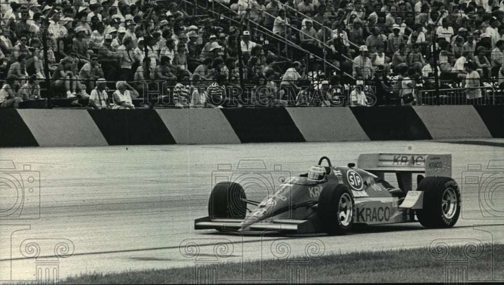 1987 Press Photo Michael Andretti passes grandstand during Miller American 200- Historic Images