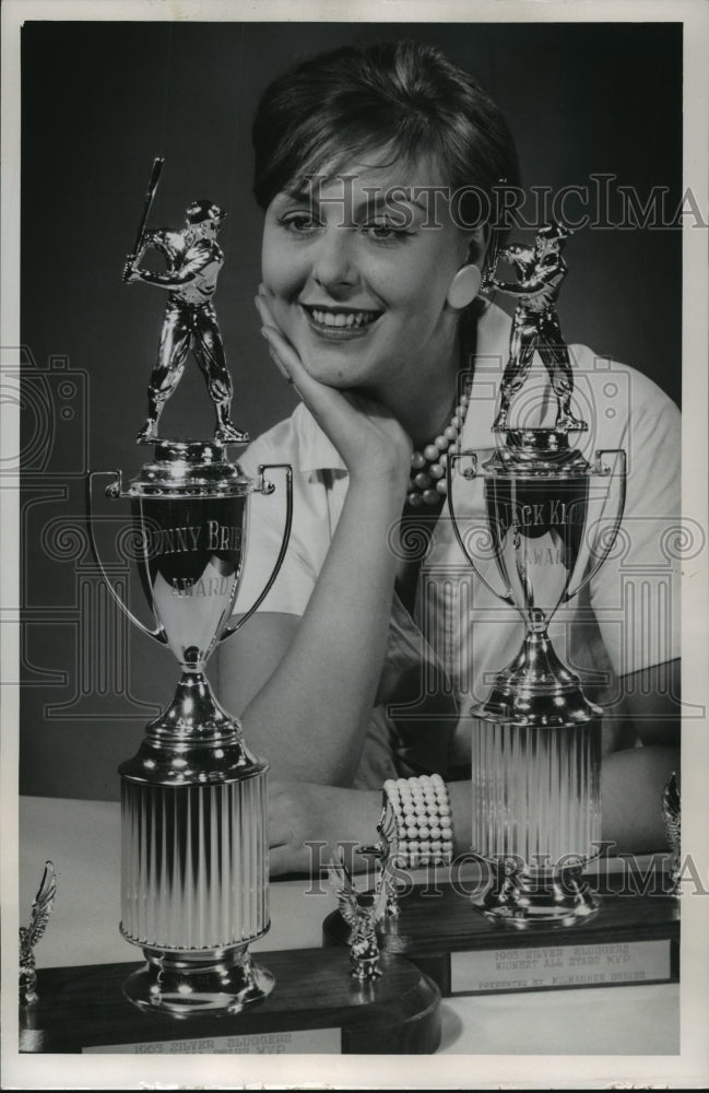 1963 Press Photo Christine Jatczak admires awards to be presented by the Braves- Historic Images