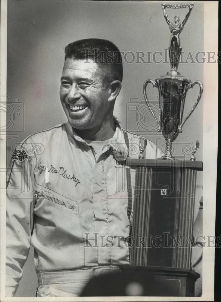 1969 Press Photo A very happy Roger McCluskey with trophy for 200 mile car race.- Historic Images