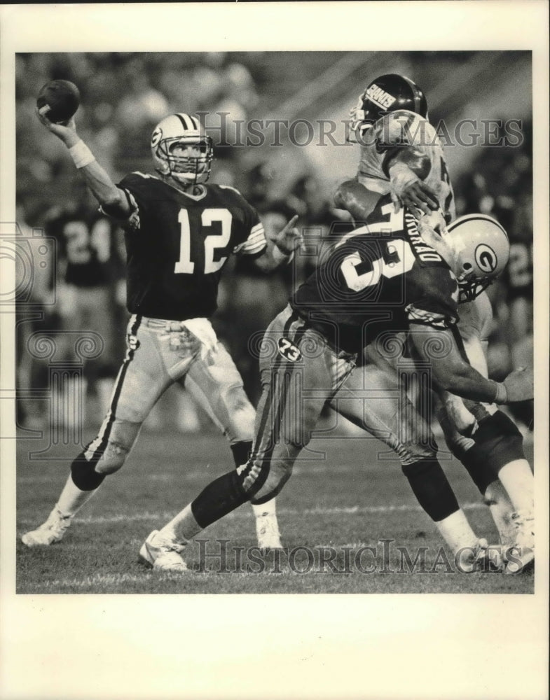 1986 Press Photo Green Bay Packers football players in action during a game- Historic Images