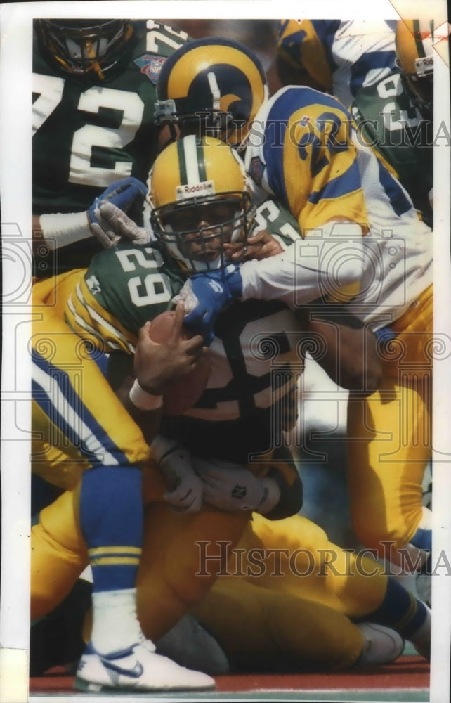 1994 Press Photo Green Bay Packers football's Marcus Wilson in middle of action- Historic Images