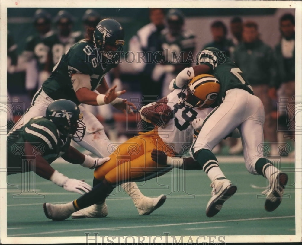 1991 Press Photo Three New York Jets tackle Packer Darrell Thompson in New York.- Historic Images