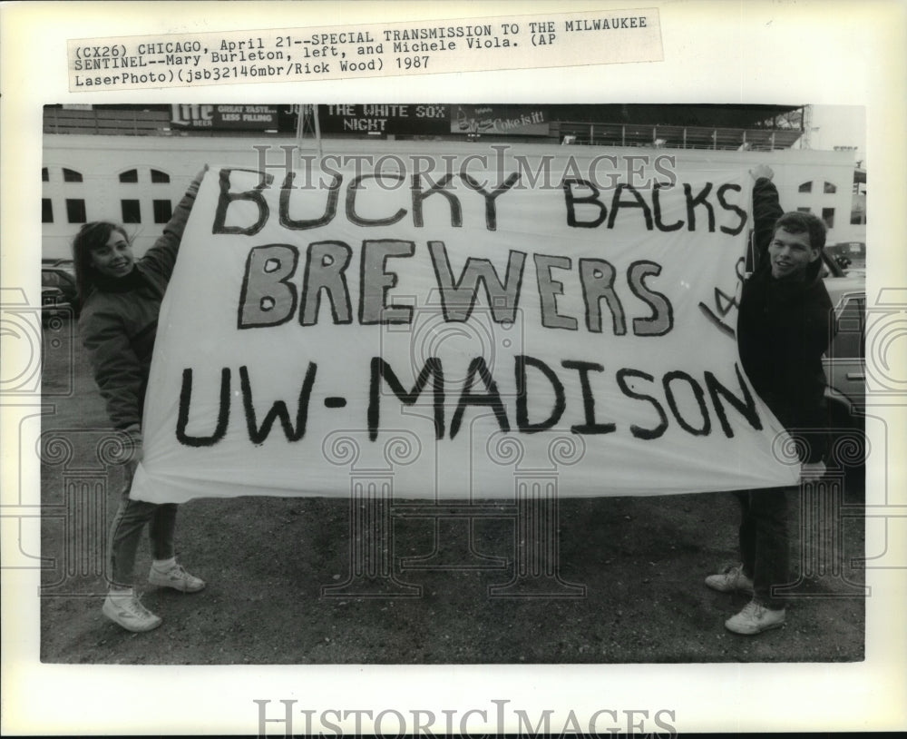 1987 Press Photo Mary Burleton (L) and Michele Viola holding sign for Brewers.- Historic Images
