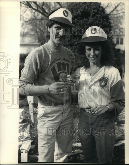 1987 Press Photo Mick Breiling & Renee Henson toast engagement and Brewer wins- Historic Images
