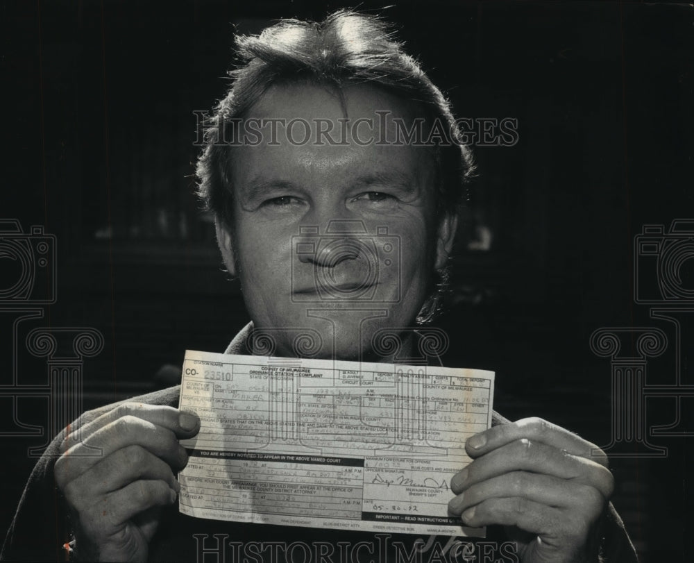 1989 Press Photo Brewers fan Rodney Maker gets ticket for tossing back ball- Historic Images